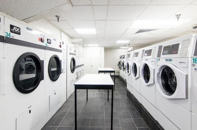 25-40 Shore Blvd Unit 17K, Astoria, NY 11102 - shared laundry room featuring washer and clothes dryer and dark tile patterned floors