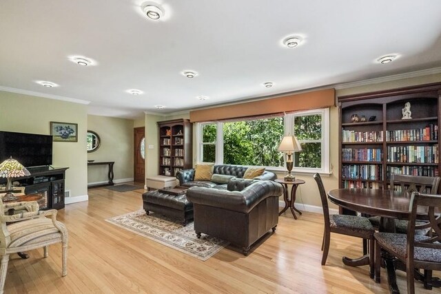76 Stony Hollow Rd, Centerport, NY 11721 - living room with crown molding and light wood finished floors