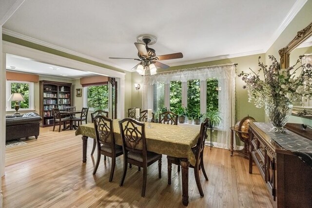 76 Stony Hollow Rd, Centerport, NY 11721 - dining area featuring light wood-style floors, a ceiling fan, and ornamental molding