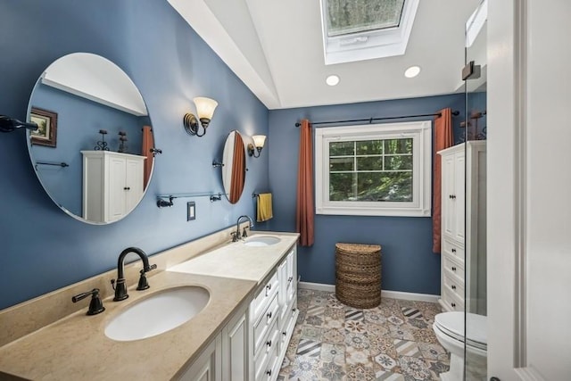 76 Stony Hollow Rd, Centerport, NY 11721 - full bath featuring a skylight, vaulted ceiling, double vanity, recessed lighting, and tile patterned floors