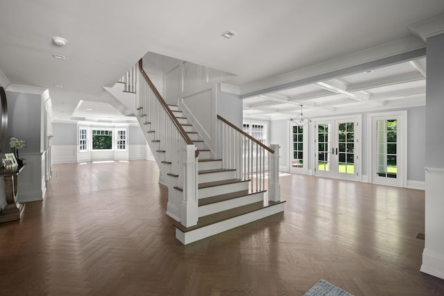 8 E Huxley Dr, Lloyd Harbor, NY 11743 - stairs featuring coffered ceiling, french doors, beamed ceiling, and wainscoting