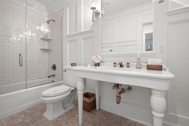 8 E Huxley Dr, Lloyd Harbor, NY 11743 - bathroom with toilet and bath / shower combo with glass door