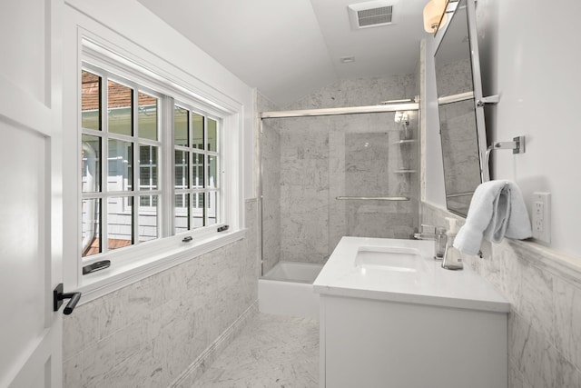 8 E Huxley Dr, Lloyd Harbor, NY 11743 - bathroom featuring lofted ceiling, vanity, and combined bath / shower with glass door