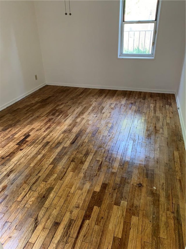 30 Davenport Ave Unit 1L, New Rochelle, NY 10805 - spare room with dark wood-type flooring and baseboards
