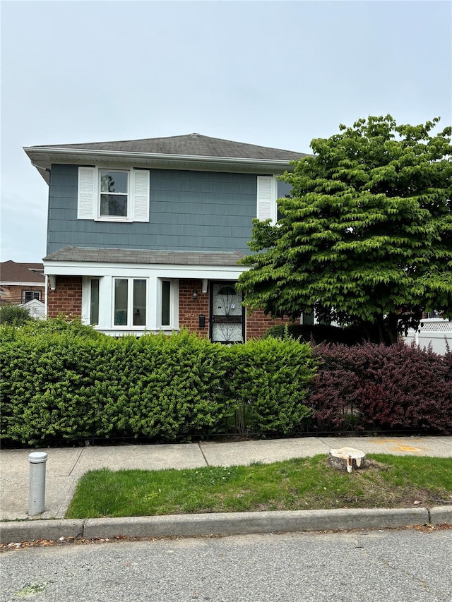 80-16 257th St, Glen Oaks, NY 11004 - view of front facade with brick siding