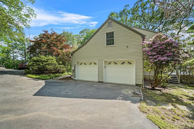 57 Wilner Rd, Somers, NY 10589 - view of home's exterior with asphalt driveway and a garage