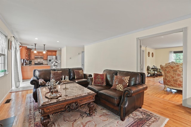 57 Wilner Rd, Somers, NY 10589 - living area with light wood-style flooring, recessed lighting, and ornamental molding