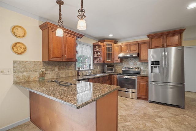 57 Wilner Rd, Somers, NY 10589 - kitchen with stainless steel appliances, brown cabinets, a peninsula, a sink, and recessed lighting