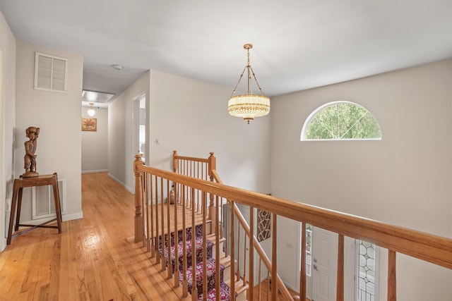 57 Wilner Rd, Somers, NY 10589 - hallway with an upstairs landing, light wood-style flooring, baseboards, and attic access