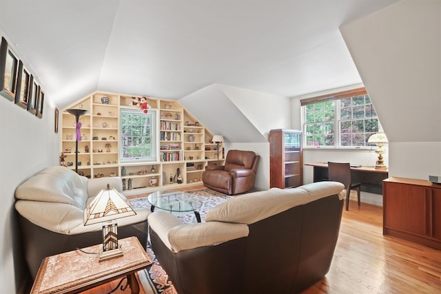 57 Wilner Rd, Somers, NY 10589 - living room with lofted ceiling, built in features, and light wood-style flooring
