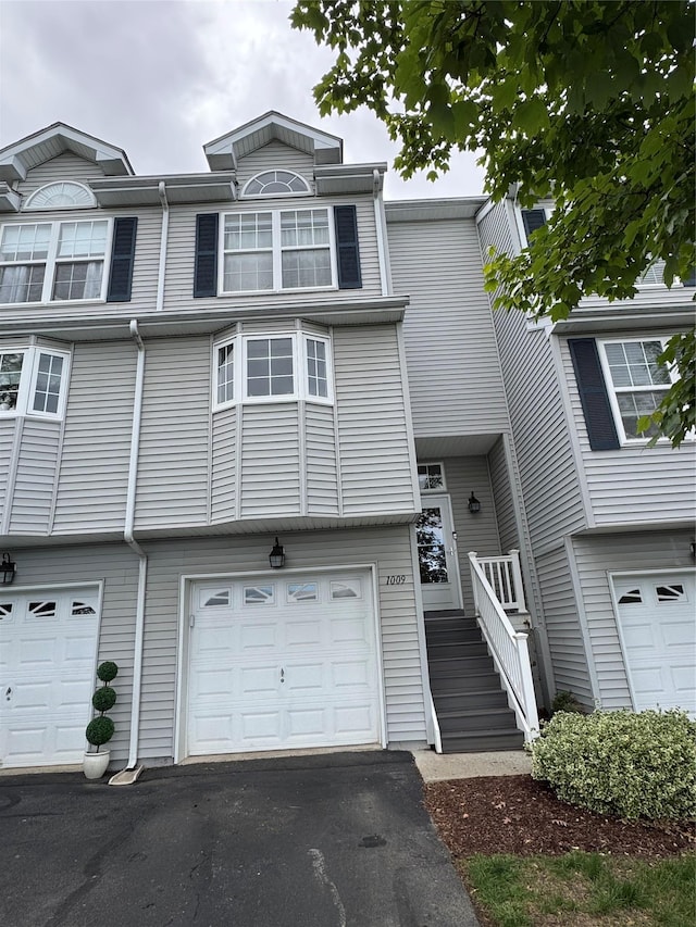 1009 Ethan Allen Dr Unit 1009, New Windsor, NY 12553 - view of property with a garage and driveway