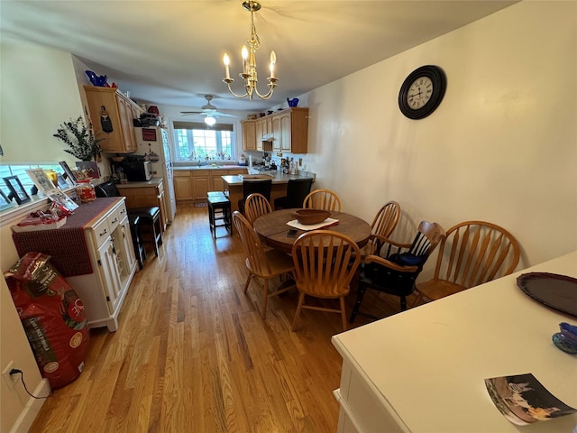 1009 Ethan Allen Dr Unit 1009, New Windsor, NY 12553 - dining area featuring light wood finished floors, a chandelier, and ceiling fan
