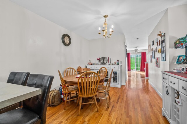 1009 Ethan Allen Dr Unit 1009, New Windsor, NY 12553 - dining area with a chandelier, light wood-style floors, ceiling fan, and baseboards