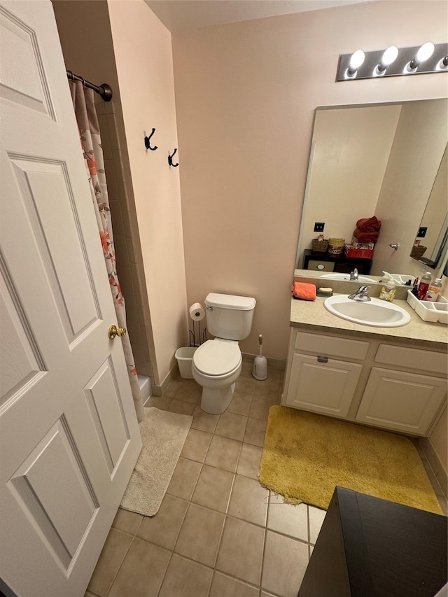 1009 Ethan Allen Dr Unit 1009, New Windsor, NY 12553 - bathroom with tile patterned floors, vanity, toilet, a shower with curtain, and baseboards