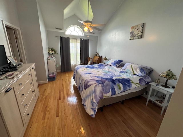 1009 Ethan Allen Dr Unit 1009, New Windsor, NY 12553 - bedroom featuring light wood-style floors, high vaulted ceiling, ceiling fan, and baseboards
