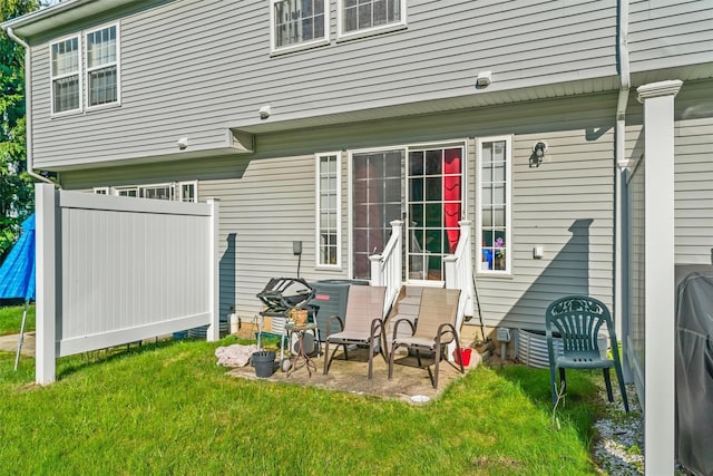 1009 Ethan Allen Dr Unit 1009, New Windsor, NY 12553 - rear view of house with a yard