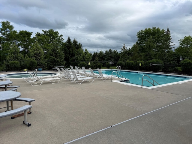 1009 Ethan Allen Dr Unit 1009, New Windsor, NY 12553 - community pool featuring a patio and view of scattered trees