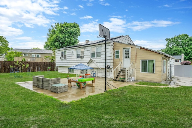 44 Juniper St, Central Islip, NY 11722 - back of house featuring entry steps, a patio, and an outdoor hangout area