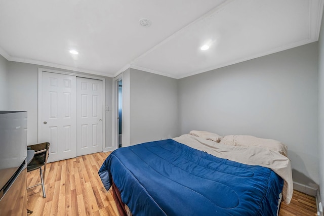44 Juniper St, Central Islip, NY 11722 - bedroom featuring light wood finished floors, ornamental molding, baseboards, a closet, and recessed lighting
