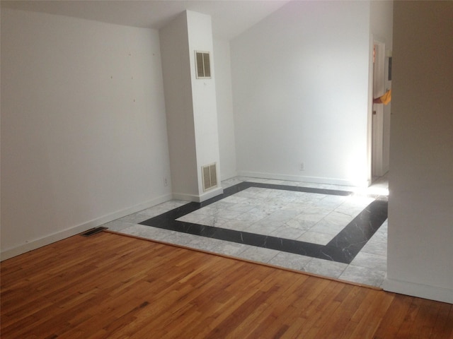 248-09 41st Ave, Little Neck, NY 11363 - unfurnished room with wood finished floors and baseboards