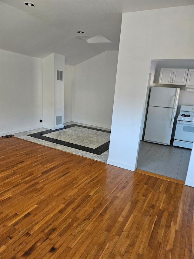 248-09 41st Ave, Little Neck, NY 11363 - unfurnished room with hardwood / wood-style floors, baseboards, and a heating unit