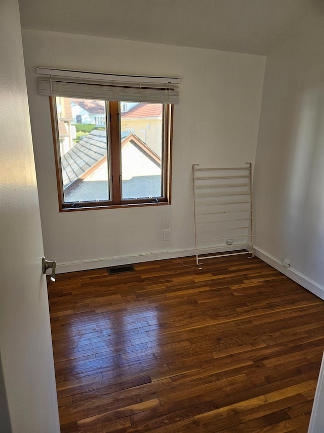 248-09 41st Ave, Little Neck, NY 11363 - unfurnished room with dark wood-type flooring and baseboards