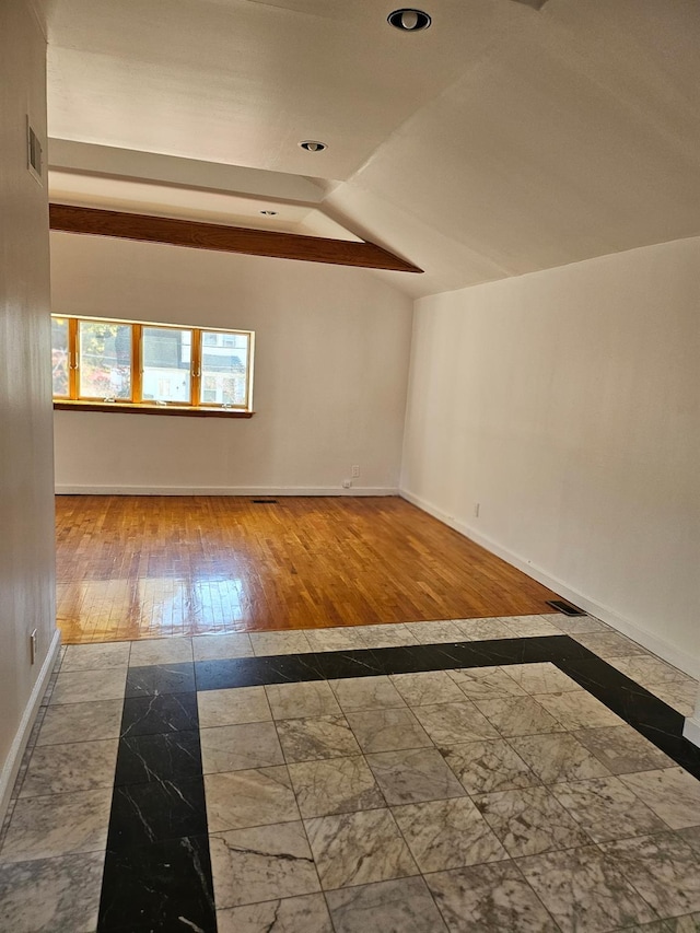 248-09 41st Ave, Little Neck, NY 11363 - additional living space with baseboards, recessed lighting, marble finish flooring, vaulted ceiling, and inlaid floor details