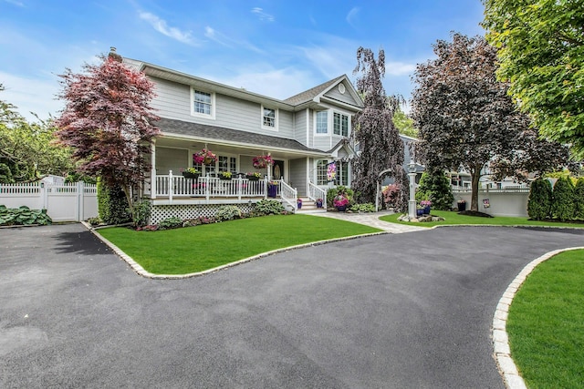 258 Timberpoint Rd, East Islip, NY 11730 - view of front facade with driveway and covered porch
