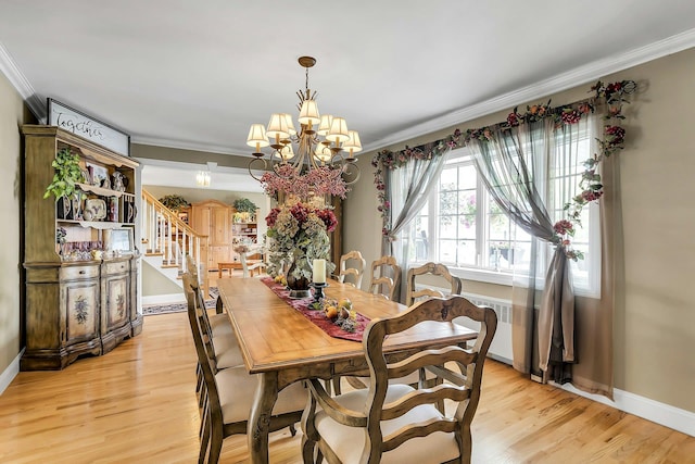 258 Timberpoint Rd, East Islip, NY 11730 - dining space with ornamental molding, a chandelier, light wood-type flooring, baseboards, and stairs