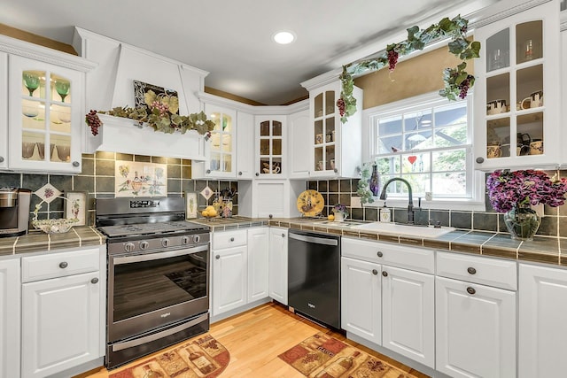 258 Timberpoint Rd, East Islip, NY 11730 - kitchen featuring stainless steel appliances, a sink, white cabinetry, and recessed lighting
