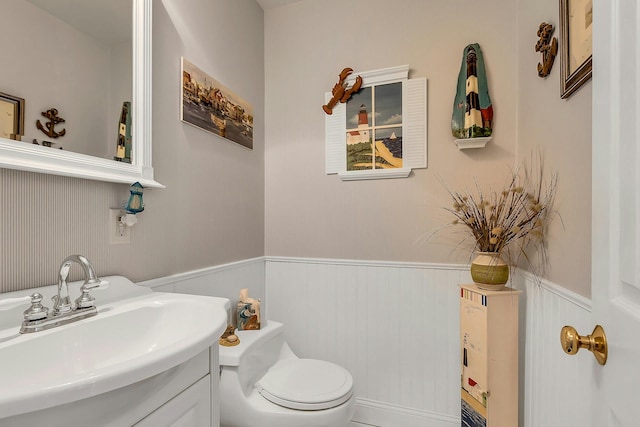 258 Timberpoint Rd, East Islip, NY 11730 - bathroom featuring wainscoting, toilet, and vanity