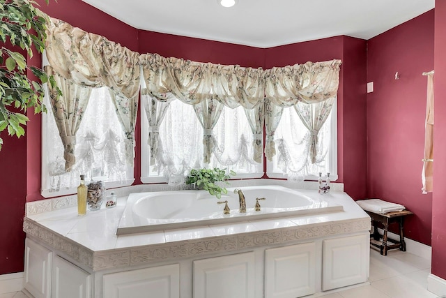 258 Timberpoint Rd, East Islip, NY 11730 - full bathroom with plenty of natural light, a garden tub, tile patterned floors, and baseboards