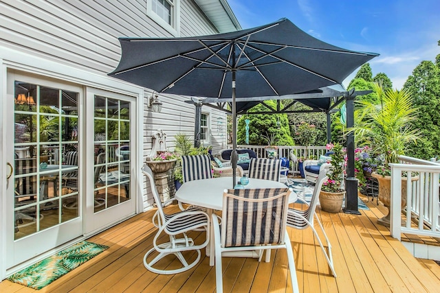 258 Timberpoint Rd, East Islip, NY 11730 - wooden terrace with outdoor dining area and an outdoor hangout area