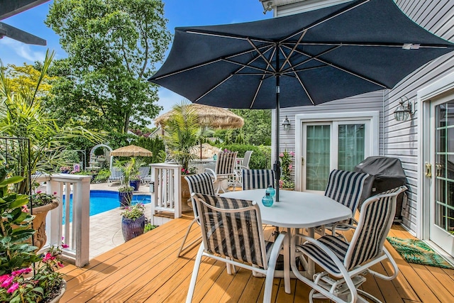 258 Timberpoint Rd, East Islip, NY 11730 - deck with outdoor dining space and an outdoor pool