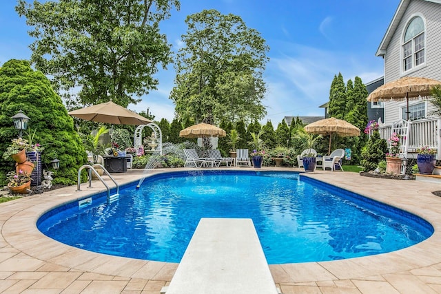 258 Timberpoint Rd, East Islip, NY 11730 - outdoor pool featuring a diving board and a patio
