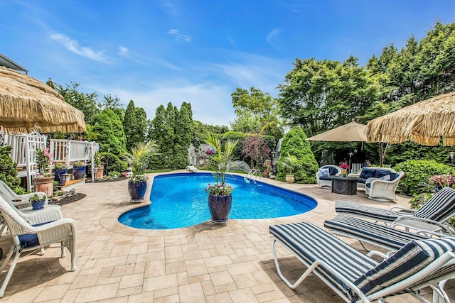 258 Timberpoint Rd, East Islip, NY 11730 - outdoor pool featuring a patio area and view of scattered trees