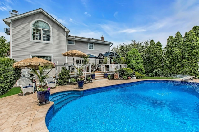 258 Timberpoint Rd, East Islip, NY 11730 - swimming pool featuring a wooden deck and a patio