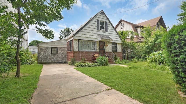 89-48 196th St, Jamaica, NY 11423 - bungalow featuring a front yard, concrete driveway, brick siding, and stone siding
