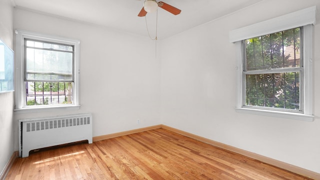 89-48 196th St, Jamaica, NY 11423 - unfurnished room with radiator, light wood finished floors, and ceiling fan