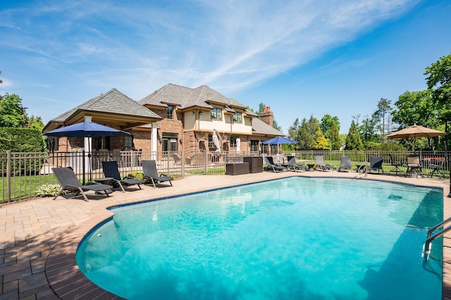 24 The Pnes, Old Westbury, NY 11568 - view of swimming pool with a patio