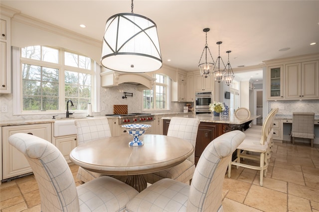 24 The Pnes, Old Westbury, NY 11568 - dining room featuring stone tile floors, crown molding, recessed lighting, and a chandelier