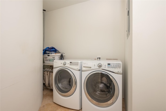 24 The Pnes, Old Westbury, NY 11568 - laundry room featuring washing machine and dryer and light tile patterned floors
