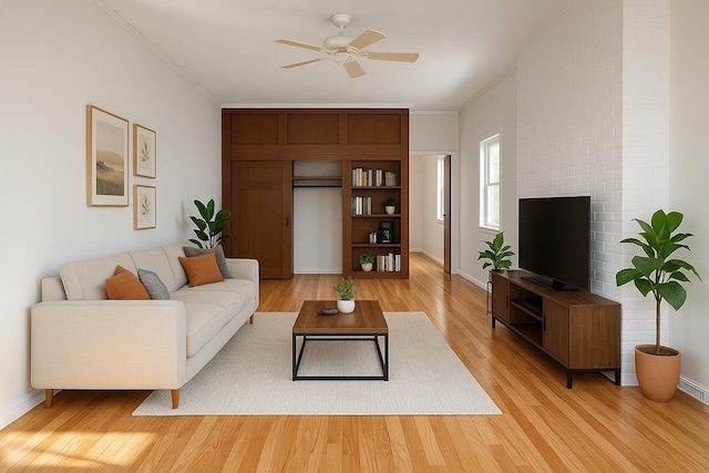 347 Graham Ave, Brooklyn, NY 11211 - living room featuring light wood-type flooring, a ceiling fan, ornamental molding, and baseboards