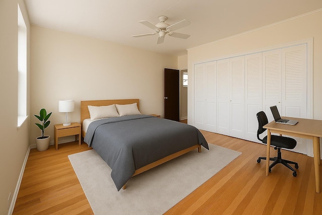 347 Graham Ave, Brooklyn, NY 11211 - bedroom featuring light wood-style floors, a closet, an office area, and baseboards