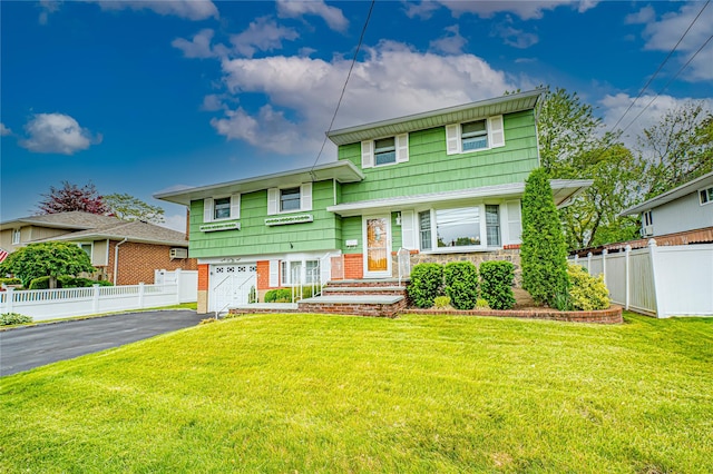 28 Chance St, Hicksville, NY 11801 - tri-level home featuring driveway and an attached garage