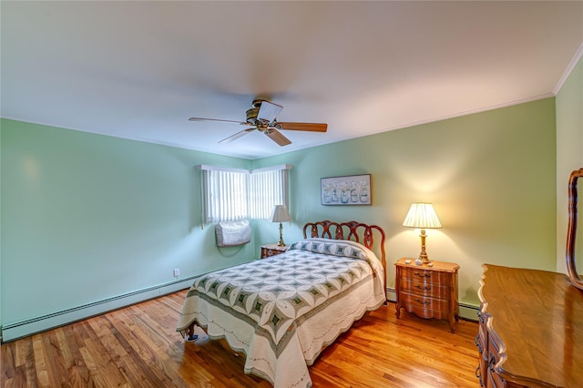 28 Chance St, Hicksville, NY 11801 - bedroom with a baseboard heating unit, wood finished floors, ceiling fan, and crown molding