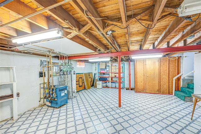 28 Chance St, Hicksville, NY 11801 - unfinished basement with a heating unit, light flooring, stairway, and water heater