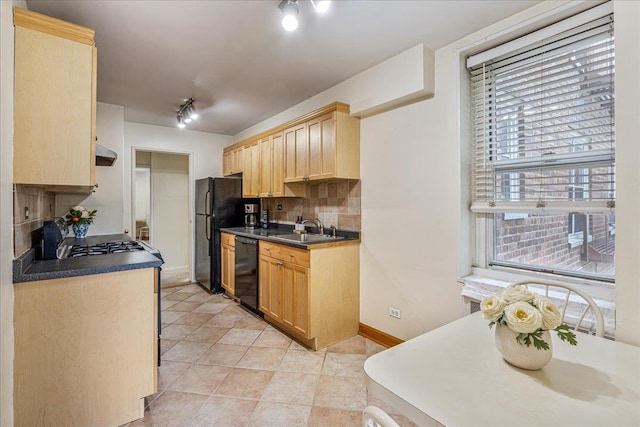 211-40 18th Ave Unit 1J, Bayside, NY 11360 - kitchen featuring light brown cabinetry, black appliances, dark countertops, under cabinet range hood, and decorative backsplash