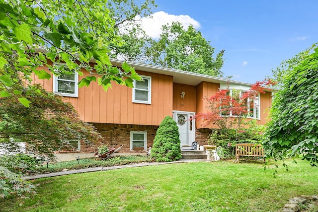 10 Catawba Dr, West Nyack, NY 10994 - raised ranch featuring a front yard and brick siding
