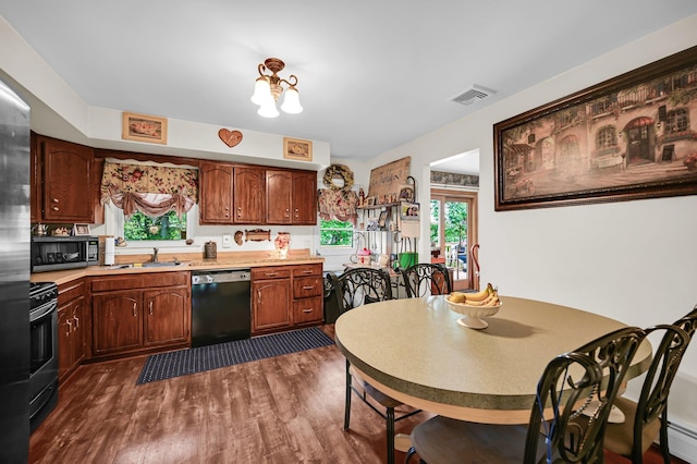 10 Catawba Dr, West Nyack, NY 10994 - kitchen featuring black appliances, dark wood-type flooring, light countertops, and a sink